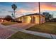 Inviting home with a well-kept lawn, brick-paved driveway, and a spacious three-car garage at 4879 Brightmour Cir, Orlando, FL 32837