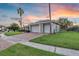 Three car garage with brick driveway and lush green lawn at 4879 Brightmour Cir, Orlando, FL 32837
