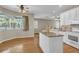 Spacious kitchen with an island, stainless steel appliances, and a breakfast nook with large windows at 4879 Brightmour Cir, Orlando, FL 32837
