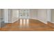 Living room features wood floors, french doors to pool, and neutral paint at 4879 Brightmour Cir, Orlando, FL 32837