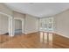 Spacious main bedroom featuring hardwood floors and a walkout to the pool area at 4879 Brightmour Cir, Orlando, FL 32837
