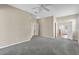 Spacious main bedroom features neutral walls, ceiling fan, and ensuite bathroom access at 4879 Brightmour Cir, Orlando, FL 32837