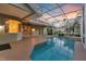 Screened in pool with access to home through multiple doorways and windows at 4879 Brightmour Cir, Orlando, FL 32837