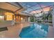 Enclosed pool area with covered patio, ceiling fans, and access to backyard at 4879 Brightmour Cir, Orlando, FL 32837