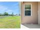 View of the spacious back yard from the home's exterior at 4998 Abigail Dr, Lake Wales, FL 33859