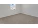 Cozy bedroom features soft carpeting and a bright window at 4998 Abigail Dr, Lake Wales, FL 33859