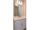 Bathroom features a single vanity with a framed mirror and modern fixtures at 5006 Abigail Dr, Lake Wales, FL 33859