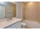 Bathroom boasts granite counters, vanity, and bathtub with shower at 5006 Abigail Dr, Lake Wales, FL 33859