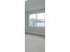 Bright bedroom featuring a large window and plush carpeting at 5006 Abigail Dr, Lake Wales, FL 33859