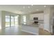 Kitchen with stainless appliances, island and sliding glass doors to the backyard at 5006 Abigail Dr, Lake Wales, FL 33859