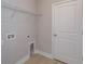 Utility room with overhead shelves and hookups for appliances at 5006 Abigail Dr, Lake Wales, FL 33859