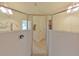 Walk-in shower with glass enclosure, sleek fixtures, and bright white tiled walls at 524 Silver Palm Dr, Haines City, FL 33844