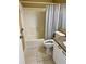Full bathroom featuring a shower/tub combo, tile flooring, and granite vanity at 529 Del Mar Dr, Lady Lake, FL 32159