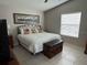 Relaxing bedroom with a large bed, soft lighting, and a decorative bench at 529 Del Mar Dr, Lady Lake, FL 32159