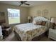 Cozy bedroom with a large window, comfortable armchair and double bed at 529 Del Mar Dr, Lady Lake, FL 32159