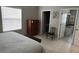 Bright bedroom featuring a full-size bed, dresser and adjacent bathroom at 529 Del Mar Dr, Lady Lake, FL 32159