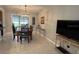 Inviting dining area featuring a chandelier, table with four chairs, and lots of natural light at 529 Del Mar Dr, Lady Lake, FL 32159