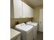 Functional laundry room with washer, dryer, and ample storage space at 529 Del Mar Dr, Lady Lake, FL 32159