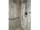Updated shower featuring neutral tile, a shower head, and a grab bar for accessibility at 529 Del Mar Dr, Lady Lake, FL 32159
