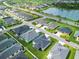 Aerial view of the neighborhood showcasing community layout and nearby water feature at 6633 Holovak Ter, The Villages, FL 34762