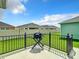 Outdoor patio area with a grill, perfect for barbecues and relaxation in the backyard at 6633 Holovak Ter, The Villages, FL 34762