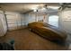 Spacious garage with tile flooring and enough room for a car and extra storage at 664 Mission Hills Trl, The Villages, FL 32162