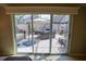 Lovely screened in patio featuring brick pavers, a hot tub, outdoor umbrella and an outdoor fireplace at 664 Mission Hills Trl, The Villages, FL 32162