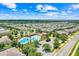 Aerial view of the community pool, surrounded by lush landscaping and comfortable seating areas at 678 Blackstone St, Minneola, FL 34715