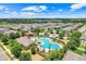 Gorgeous aerial view of neighborhood amenities including pool, clubhouse and surrounding landscape at 678 Blackstone St, Minneola, FL 34715