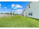 Expansive backyard with lush green grass, privacy fence, and ample space for outdoor activities at 678 Blackstone St, Minneola, FL 34715