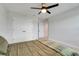 Bedroom with ceiling fan, closet, and neutral carpet flooring at 678 Blackstone St, Minneola, FL 34715
