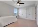 Bedroom features a twin bed, plush carpet, and a closet at 678 Blackstone St, Minneola, FL 34715