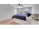 A bedroom with carpet, a white bed frame with built-in storage, and a ceiling fan at 678 Blackstone St, Minneola, FL 34715