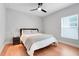 Cozy bedroom featuring a ceiling fan, and a window with bright natural light at 678 Blackstone St, Minneola, FL 34715