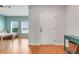Inviting entryway with hardwood floors and view into a sitting room at 678 Blackstone St, Minneola, FL 34715
