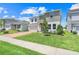 Charming two-story home with a well-manicured lawn, brick driveway, and inviting curb appeal at 678 Blackstone St, Minneola, FL 34715
