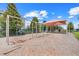 Community playground with swings and slides surrounded by lush landscaping and soft ground cover at 678 Blackstone St, Minneola, FL 34715