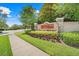 Entrance to Ardmore Reserve with detailed signage, manicured landscaping, and tree lined street at 678 Blackstone St, Minneola, FL 34715