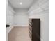 Functional walk-in closet with built-in shelving and space for organized storage at 678 Blackstone St, Minneola, FL 34715