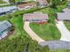 Bird's-eye view of home with lush lawns and a long driveway, offering great curb appeal at 71 Stone Haven Ct, Leesburg, FL 34788