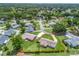 Expansive aerial view of home showing mature landscaping, and winding driveway at 71 Stone Haven Ct, Leesburg, FL 34788