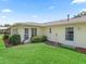 Spacious backyard featuring lush green grass and manicured landscaping at 71 Stone Haven Ct, Leesburg, FL 34788