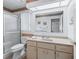 Bright bathroom featuring vanity with ample counter space, updated fixtures, and walk-in shower at 71 Stone Haven Ct, Leesburg, FL 34788