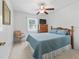 Comfortable bedroom with natural light, a ceiling fan, and a classic wooden dresser at 71 Stone Haven Ct, Leesburg, FL 34788