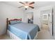 Well-lit bedroom with a mirrored closet and an open door to the bathroom at 71 Stone Haven Ct, Leesburg, FL 34788