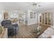 The living room shows hard floors, natural light, and seamless transition to the dining area at 71 Stone Haven Ct, Leesburg, FL 34788