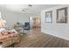 Living room features bright natural light, hard floors, neutral walls, and simple decor at 71 Stone Haven Ct, Leesburg, FL 34788