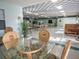 Large gathering room features tables, chairs, and ample lighting at 71 Stone Haven Ct, Leesburg, FL 34788