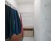 Organized walk-in closet with shelving units and a hanging rack for efficient storage solutions at 71 Stone Haven Ct, Leesburg, FL 34788