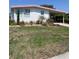 Beautiful residence featuring a carport, well-manicured lawn, and a comfortable setting at 715 Surrey Pl, Leesburg, FL 34748